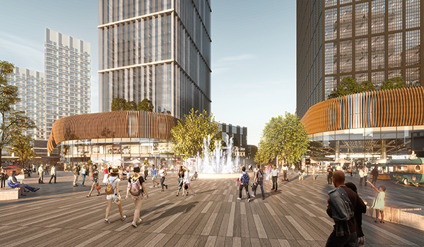 rendering of people enjoying a public plaza with a fountain at its heart, with mixed use buildings on either side featuring retail in the podiums and high rise residential towers above